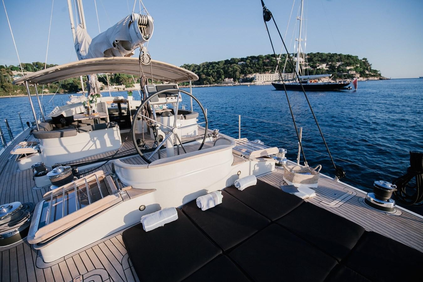 a boat docked at a pier aboard VINTAGE I Yacht for Sale