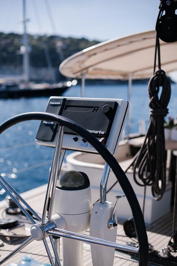 a boat with a steering wheel aboard VINTAGE I Yacht for Sale