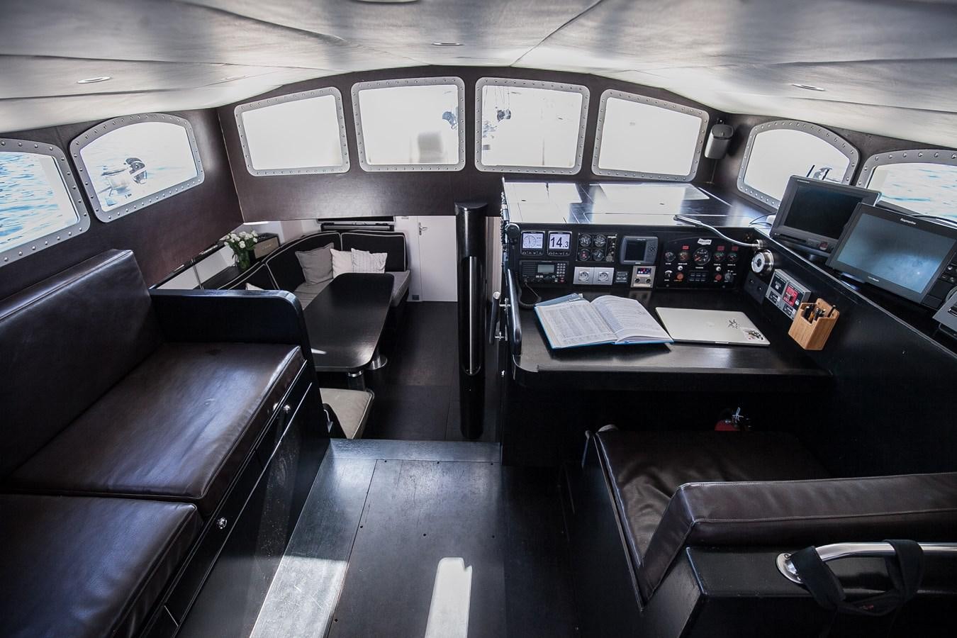 an airplane cockpit with many monitors aboard VINTAGE I Yacht for Sale