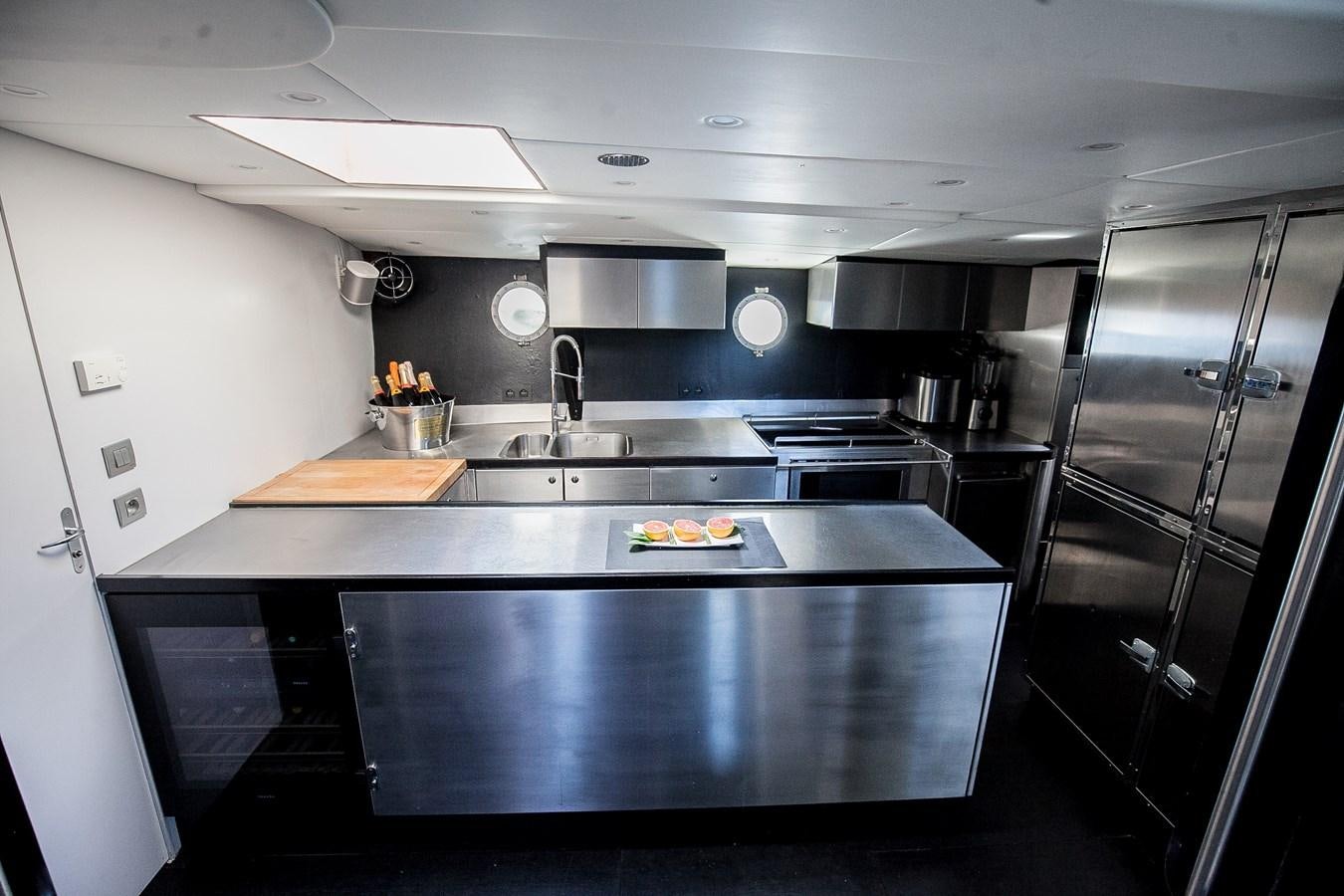 a kitchen with a black counter top aboard VINTAGE I Yacht for Sale