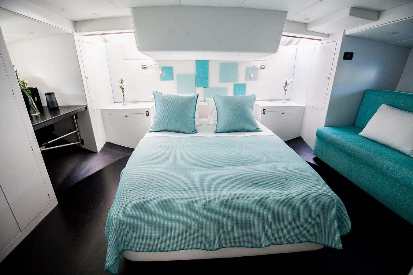 a bed in a room aboard VINTAGE I Yacht for Sale