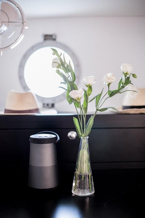 a vase with white flowers aboard VINTAGE I Yacht for Sale