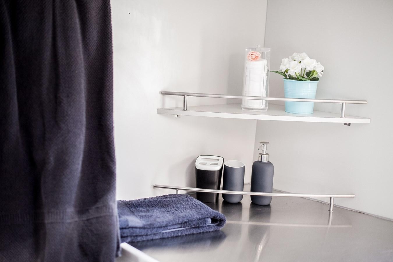 a shelf with a towel and a can on it aboard VINTAGE I Yacht for Sale