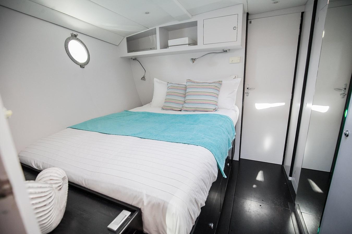 a bed in a room aboard VINTAGE I Yacht for Sale