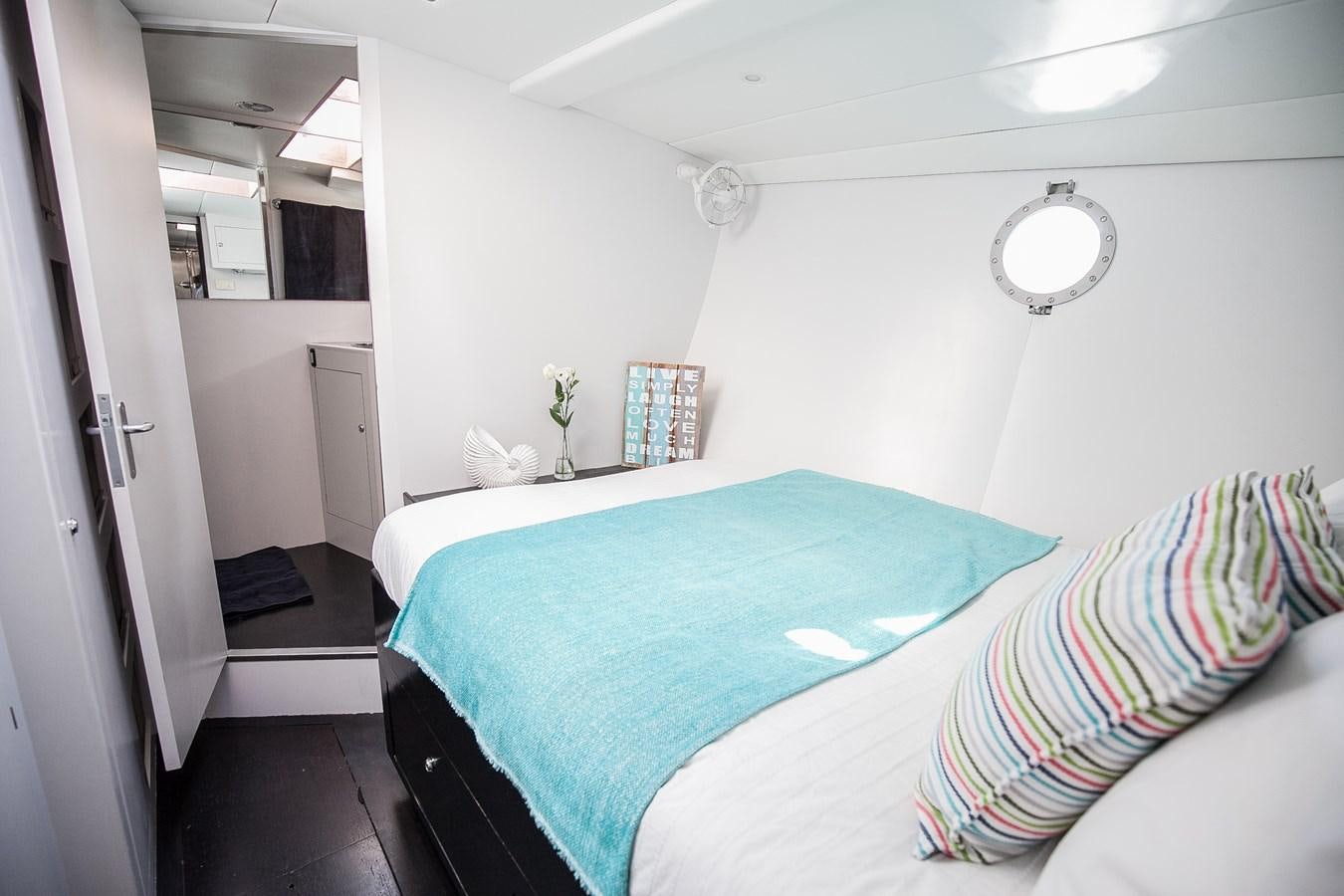 a room with two beds aboard VINTAGE I Yacht for Sale