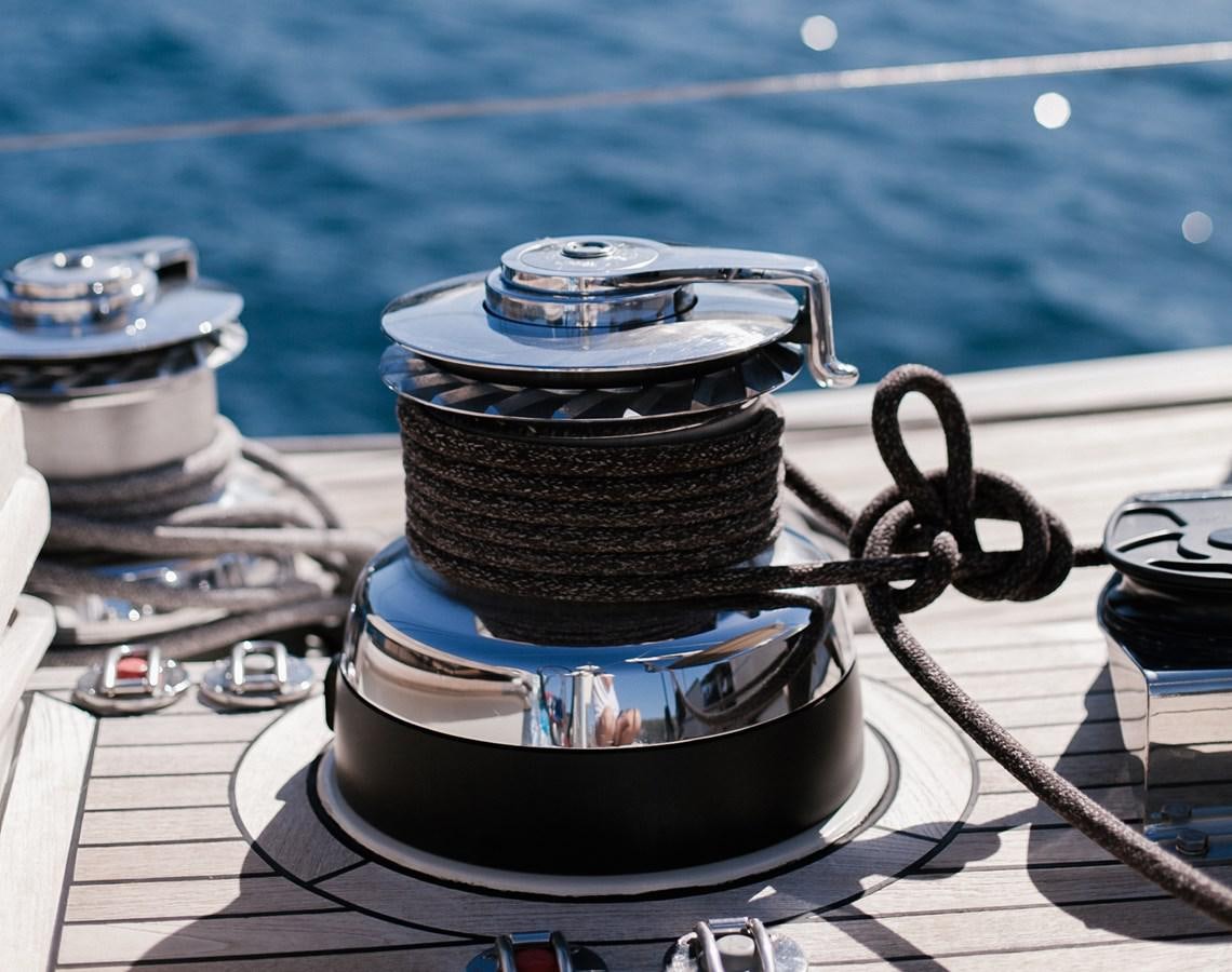 a stack of metal pots on a table by a pool aboard VINTAGE I Yacht for Sale