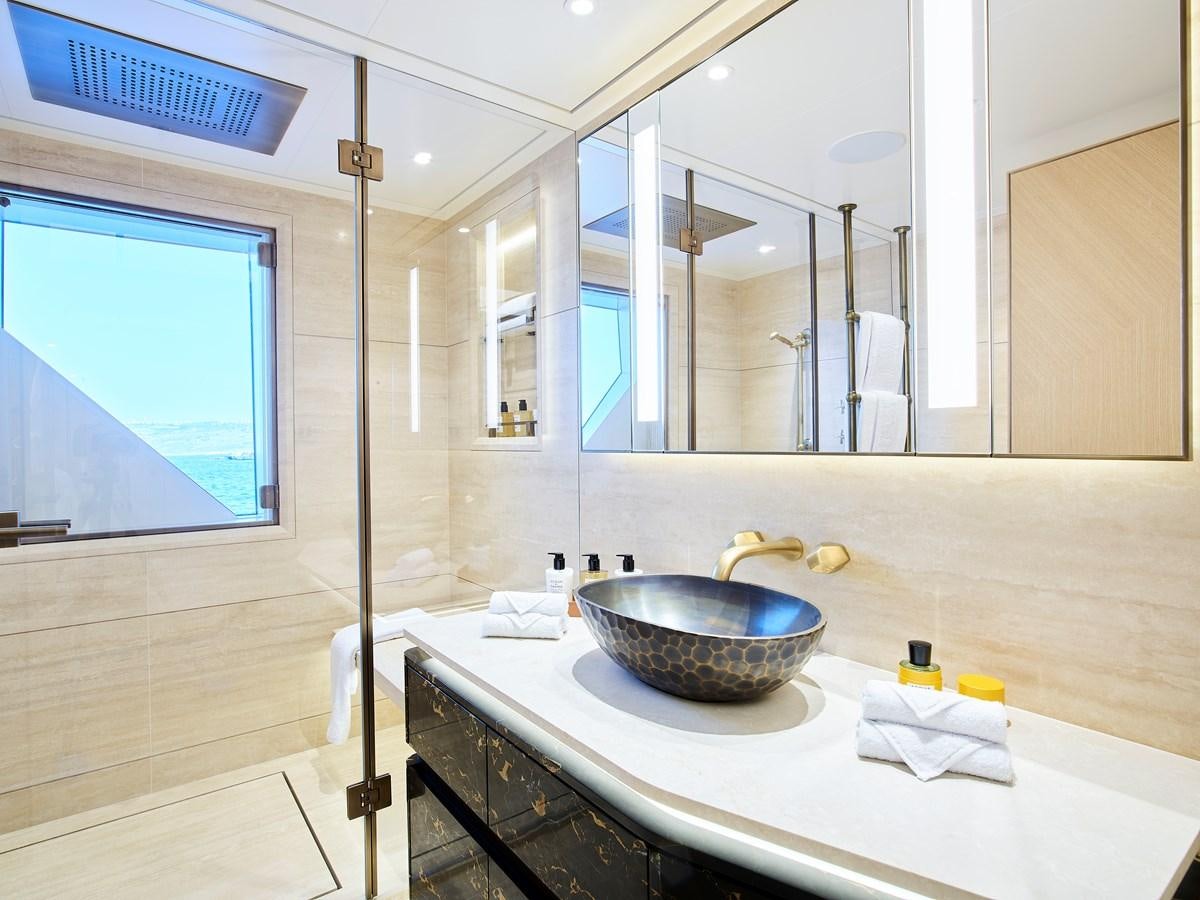 a bathroom with a sink and a mirror aboard COME TOGETHER Yacht for Charter