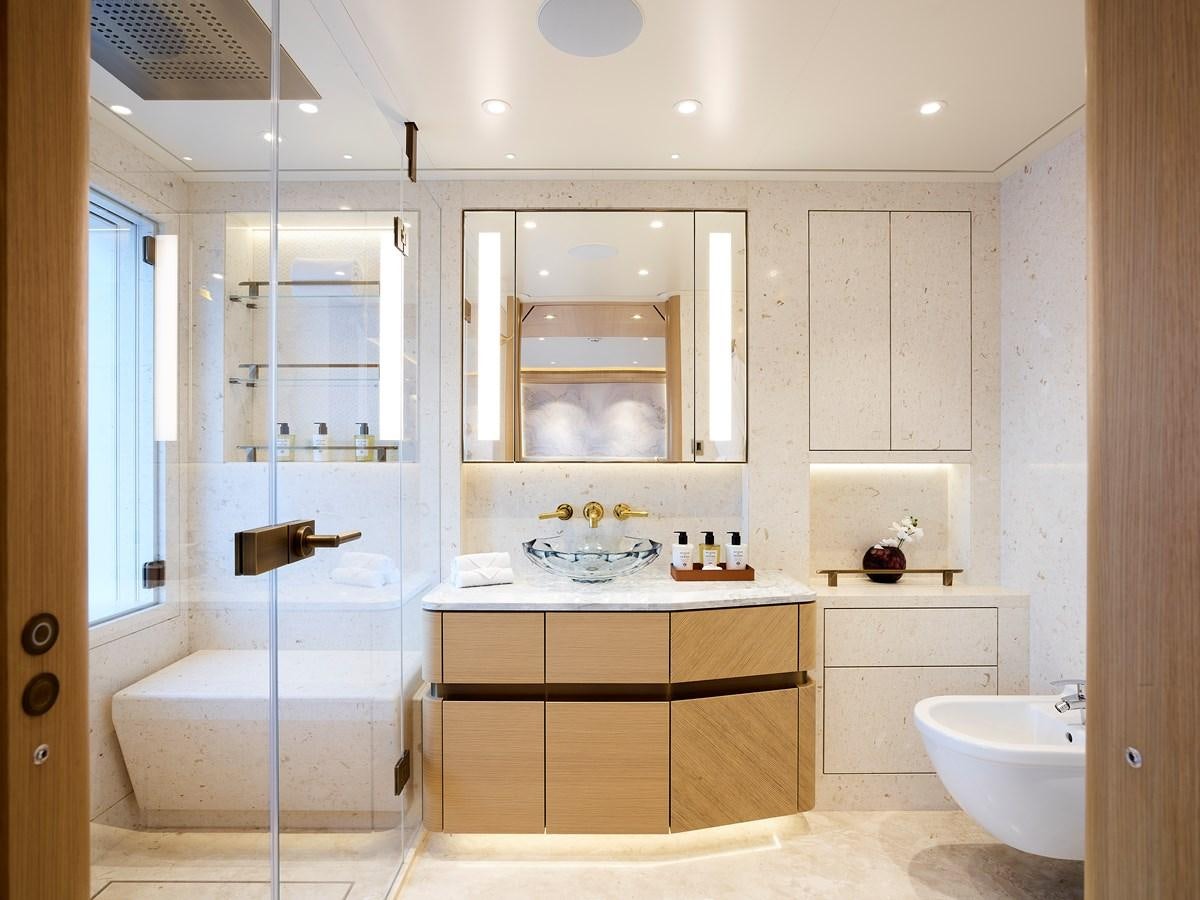 a bathroom with a glass shower aboard COME TOGETHER Yacht for Charter