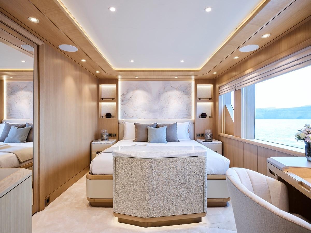 a large bedroom with a bed aboard COME TOGETHER Yacht for Charter