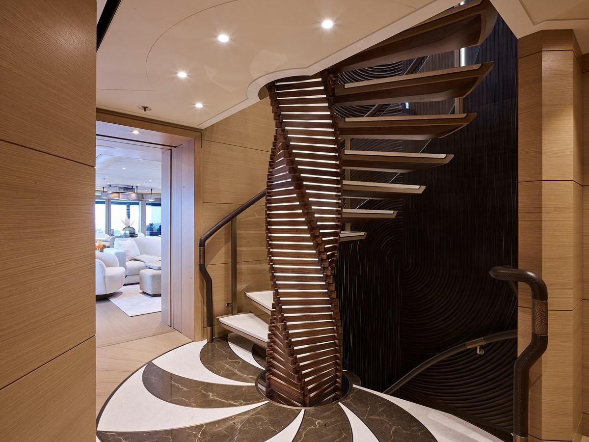 a wood staircase in a room aboard COME TOGETHER Yacht for Charter
