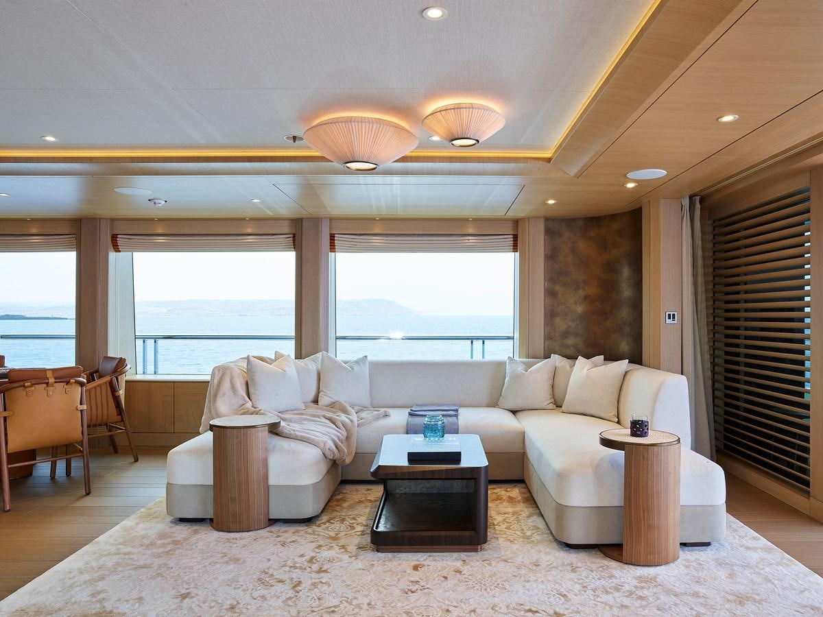 a living room with a large window aboard COME TOGETHER Yacht for Charter