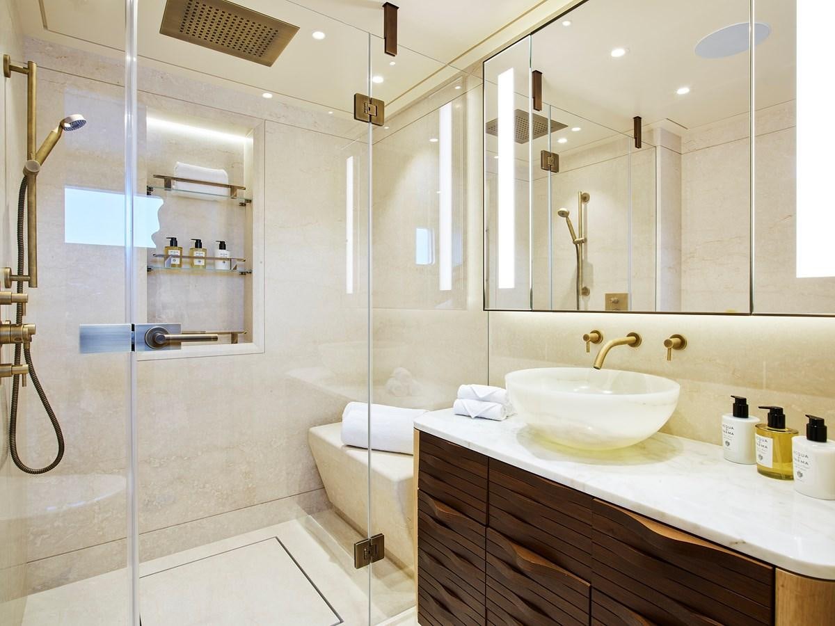 a bathroom with a glass shower aboard COME TOGETHER Yacht for Charter