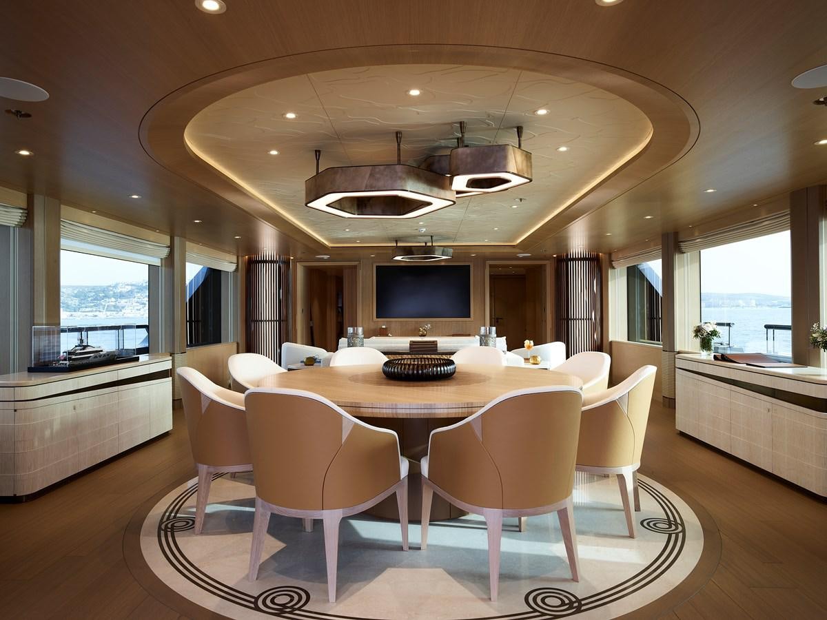 a dining room with a table and chairs aboard COME TOGETHER Yacht for Charter