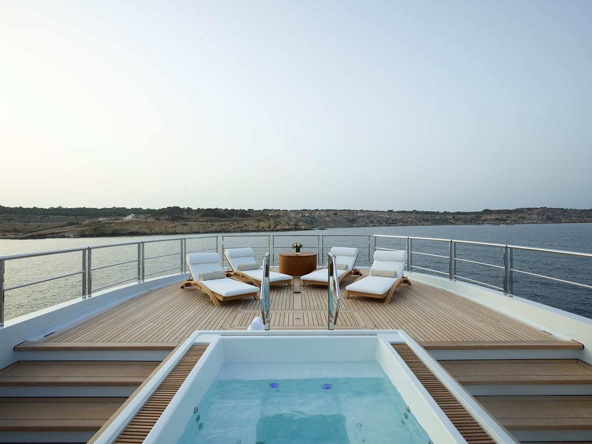 a deck with chairs and tables on it aboard COME TOGETHER Yacht for Charter