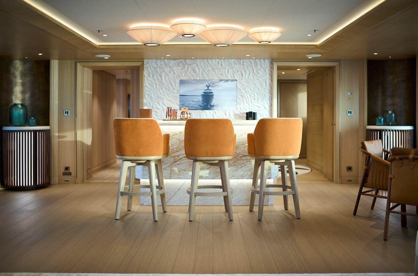 a room with chairs and a table aboard COME TOGETHER Yacht for Charter