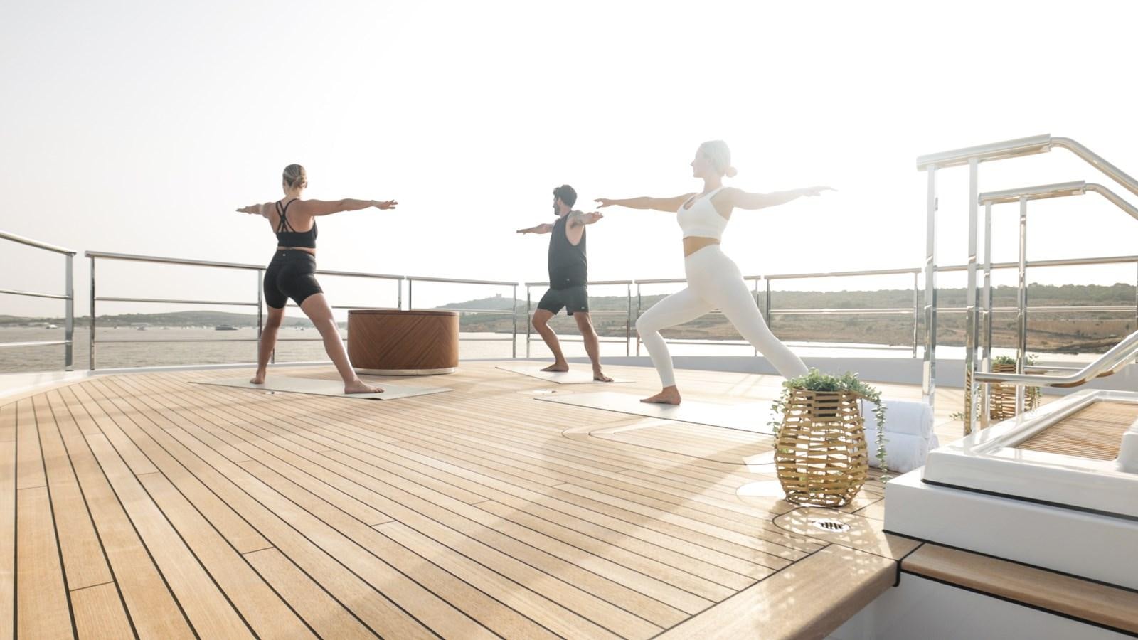 a group of people on a deck aboard COME TOGETHER Yacht for Charter