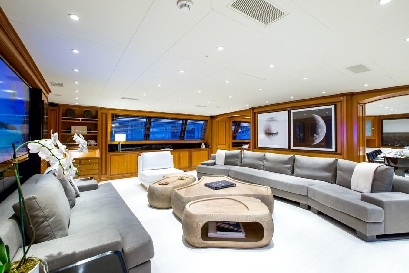 a living room with a large screen aboard PERSEUS Yacht for Charter
