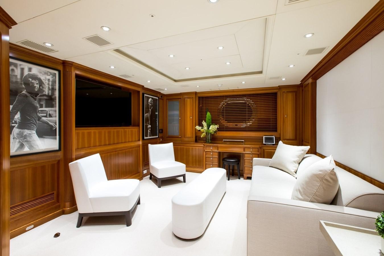 a room with a couch and a tv aboard PERSEUS Yacht for Charter