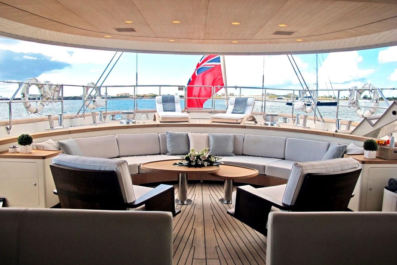 a room with a large window and a red flag aboard PERSEUS Yacht for Sale