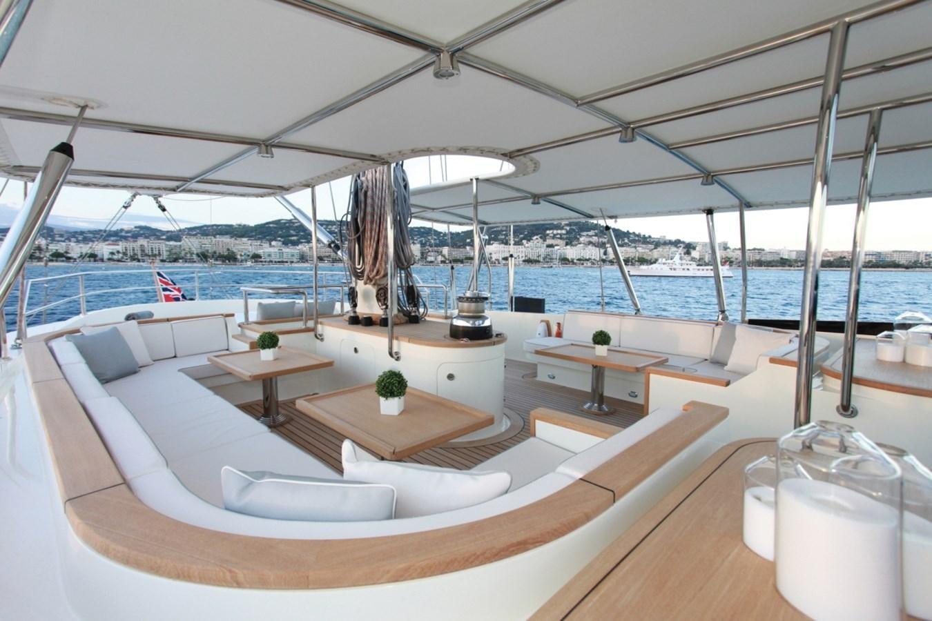 a room with a view of the water and a city aboard PERSEUS Yacht for Charter
