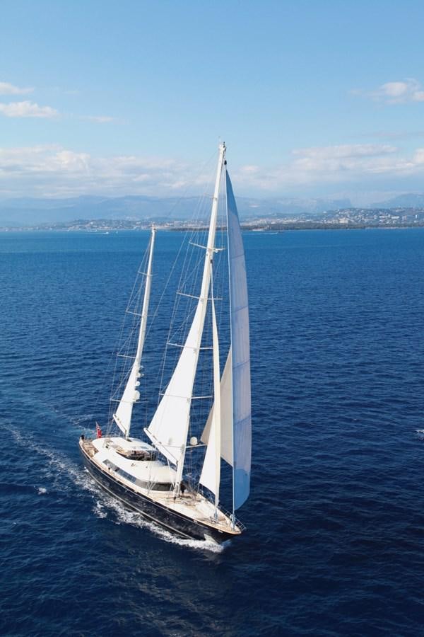 a white boat on the water aboard PERSEUS Yacht for Sale