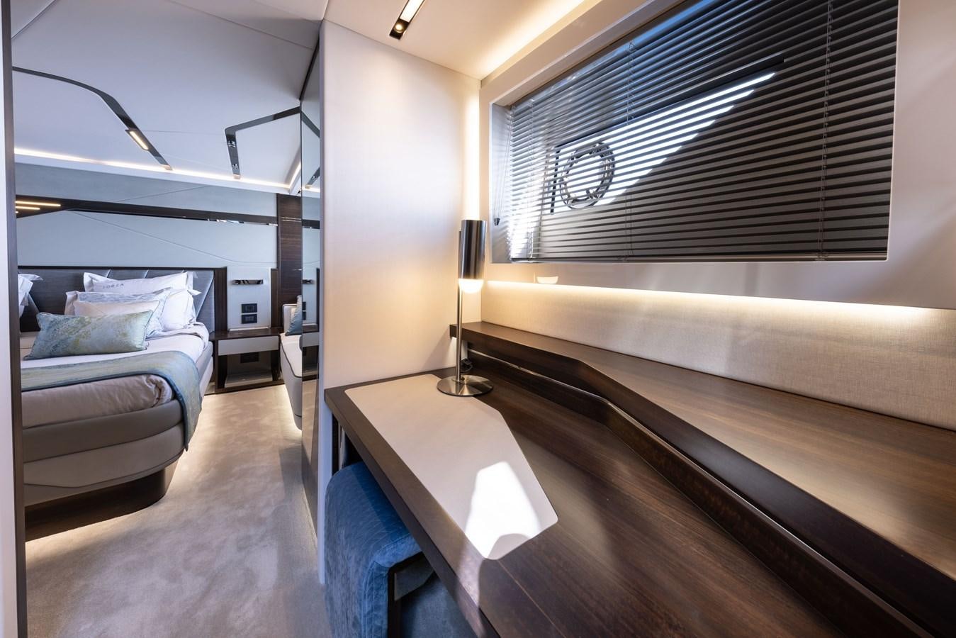 a room with a bed and a desk aboard FORZA Yacht for Sale