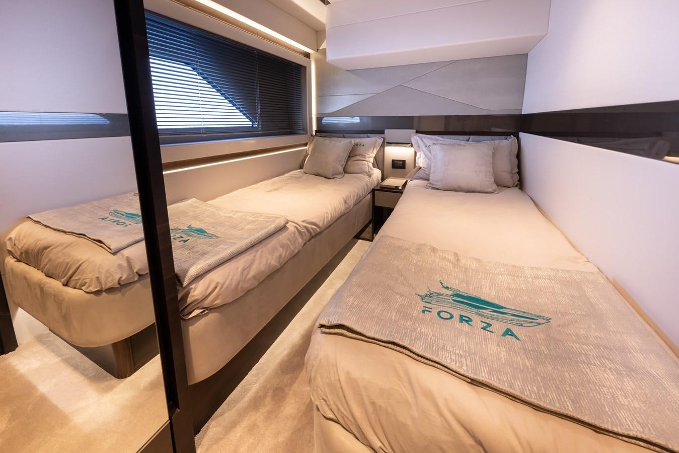 a couple of beds in a room aboard FORZA Yacht for Sale