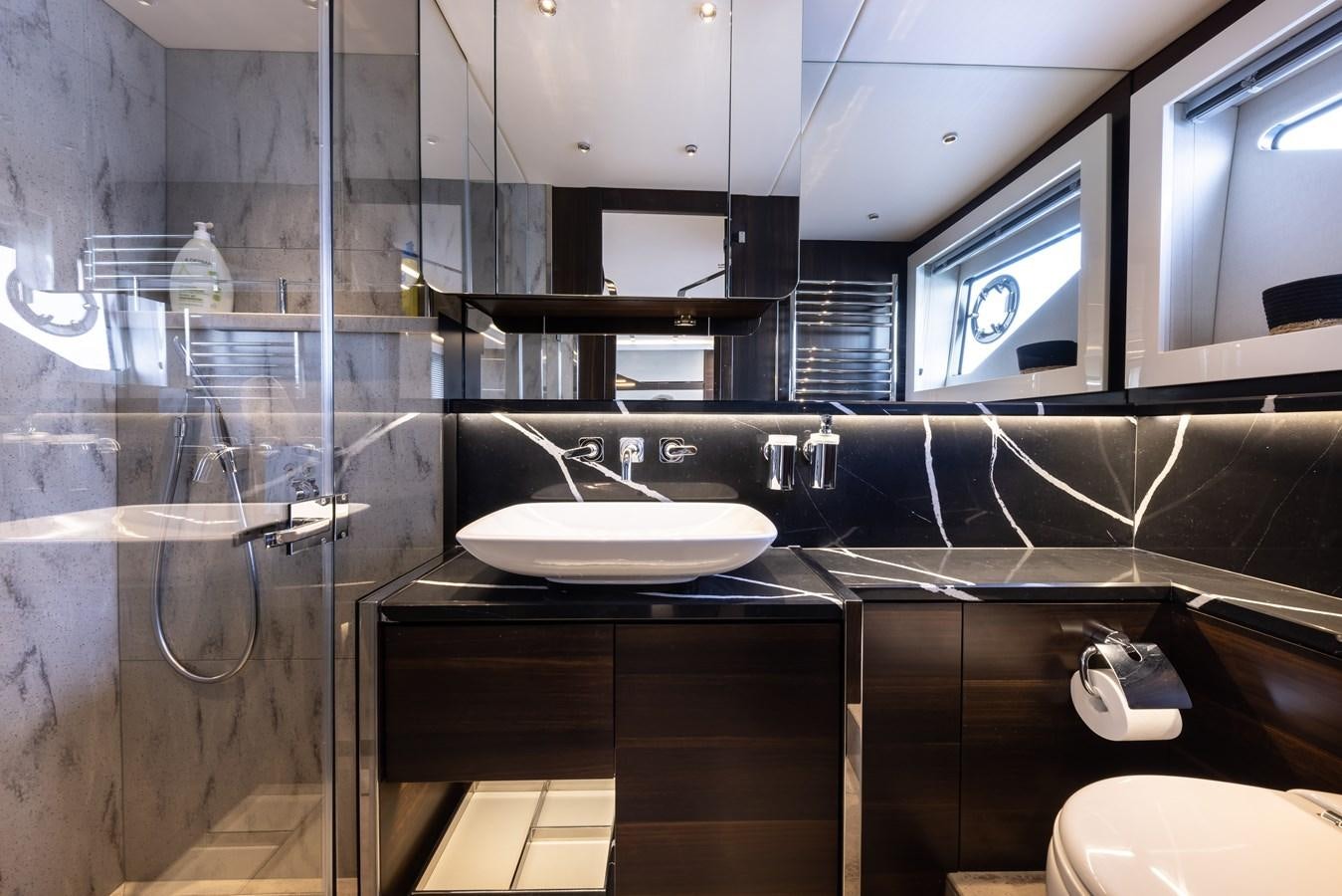 a bathroom with a sink and a toilet aboard FORZA Yacht for Sale
