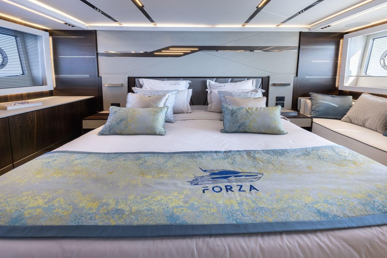 a bed with pillows aboard FORZA Yacht for Sale