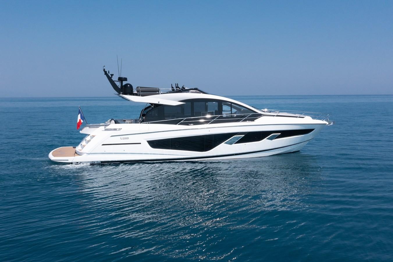 a white yacht in the water aboard FORZA Yacht for Sale