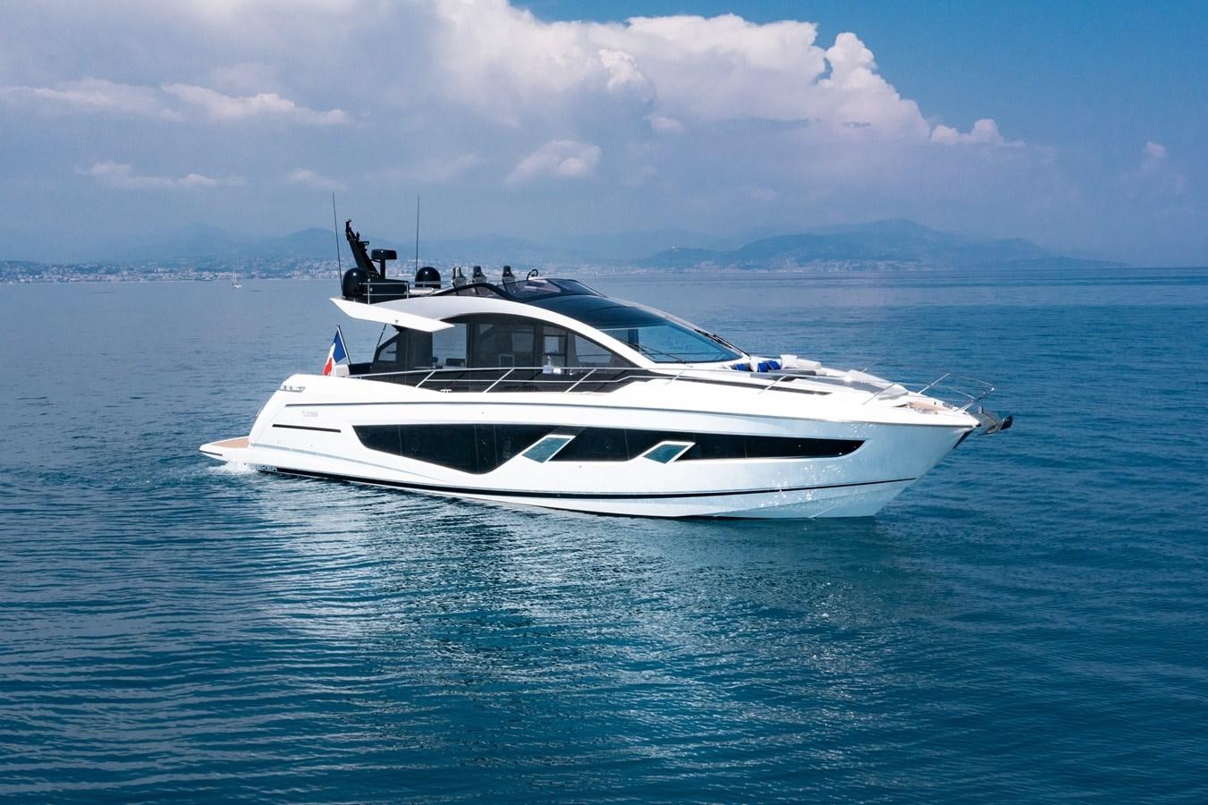 a white yacht in the water aboard FORZA Yacht for Sale