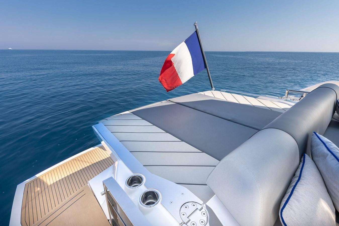 a boat with a flag on the front aboard FORZA Yacht for Sale