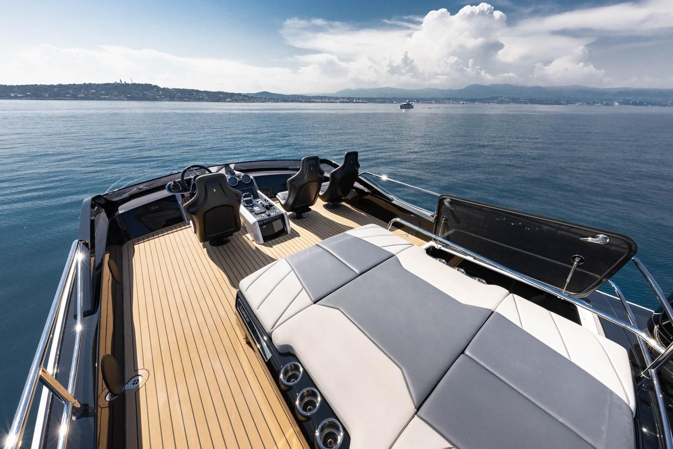 a boat with a deck and a couple of boats on it aboard FORZA Yacht for Sale