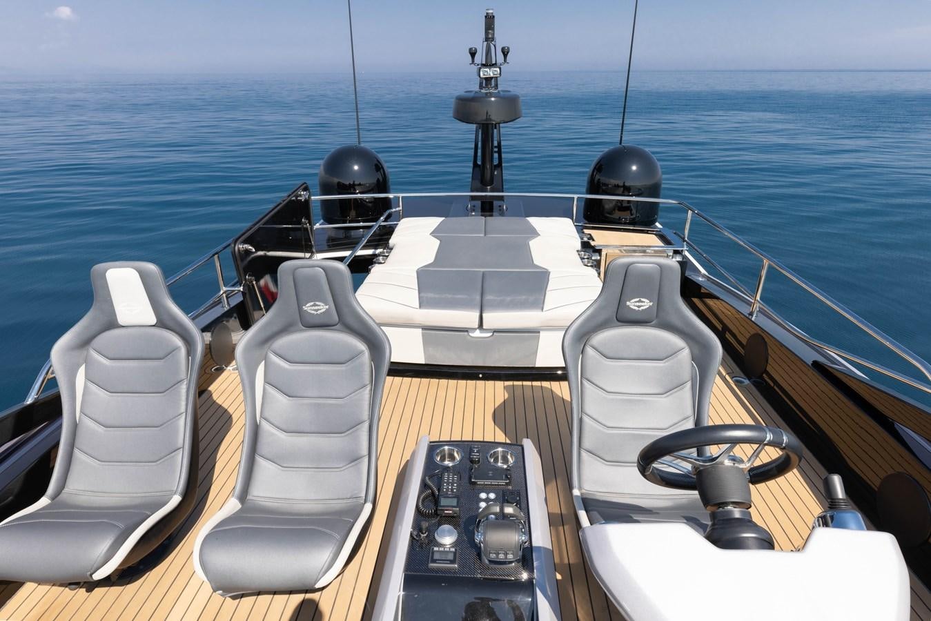 a boat with a desk and a couple of speakers on it aboard FORZA Yacht for Sale