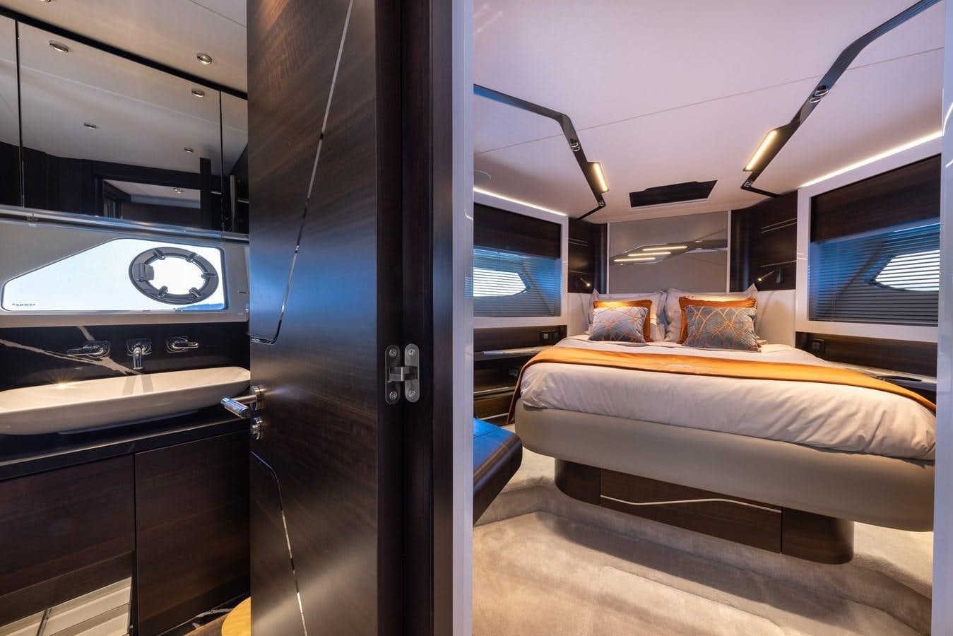 a room with a bed and a tv aboard FORZA Yacht for Sale