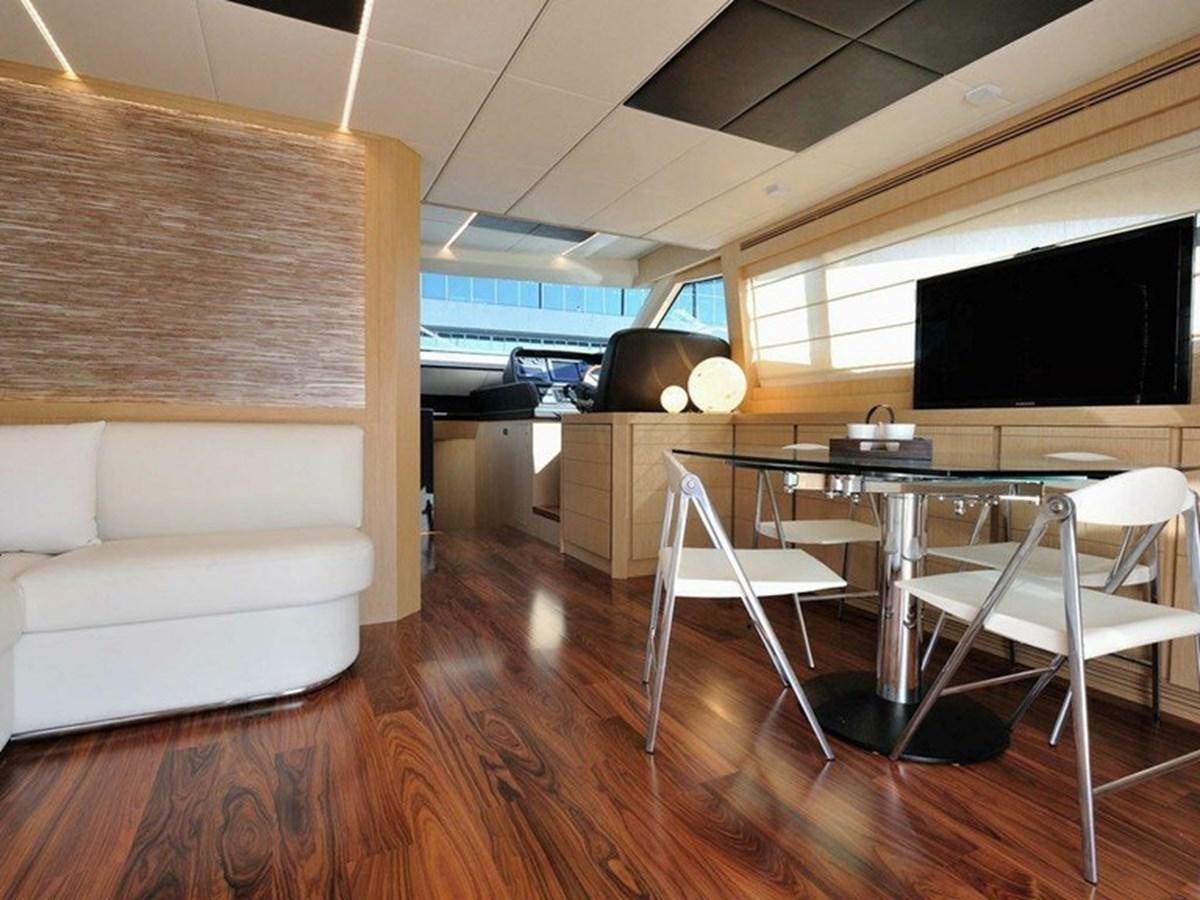 a room with a table and chairs aboard AUSTIN PARKER - 72 FLY Yacht for Sale