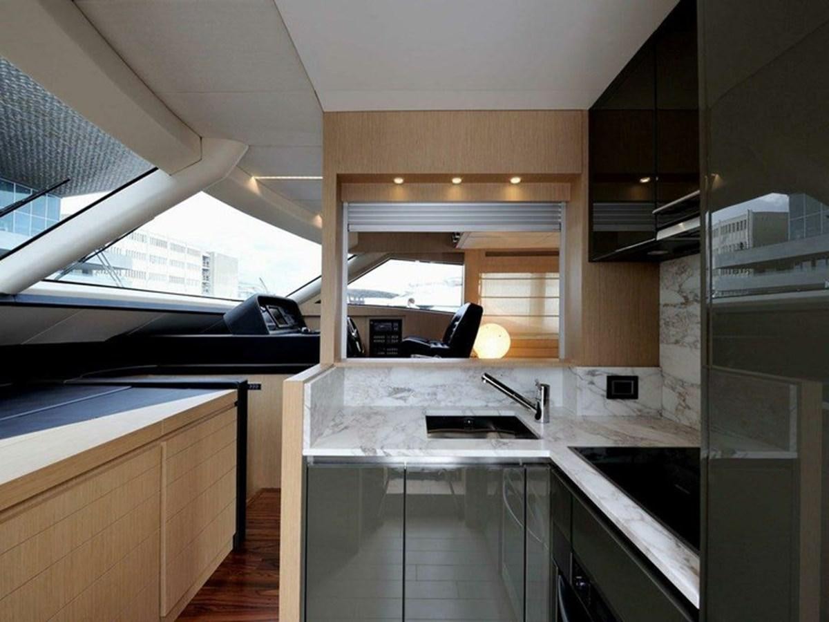 a kitchen with a large window aboard AUSTIN PARKER - 72 FLY Yacht for Sale