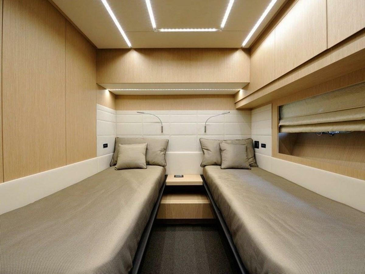 a room with a couple of beds aboard AUSTIN PARKER - 72 FLY Yacht for Sale