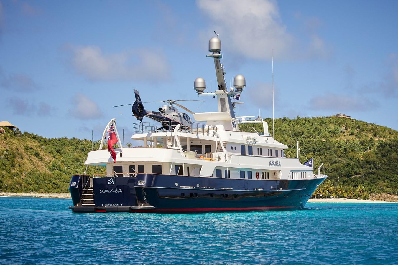 a large boat in the water aboard AMARA Yacht for Sale