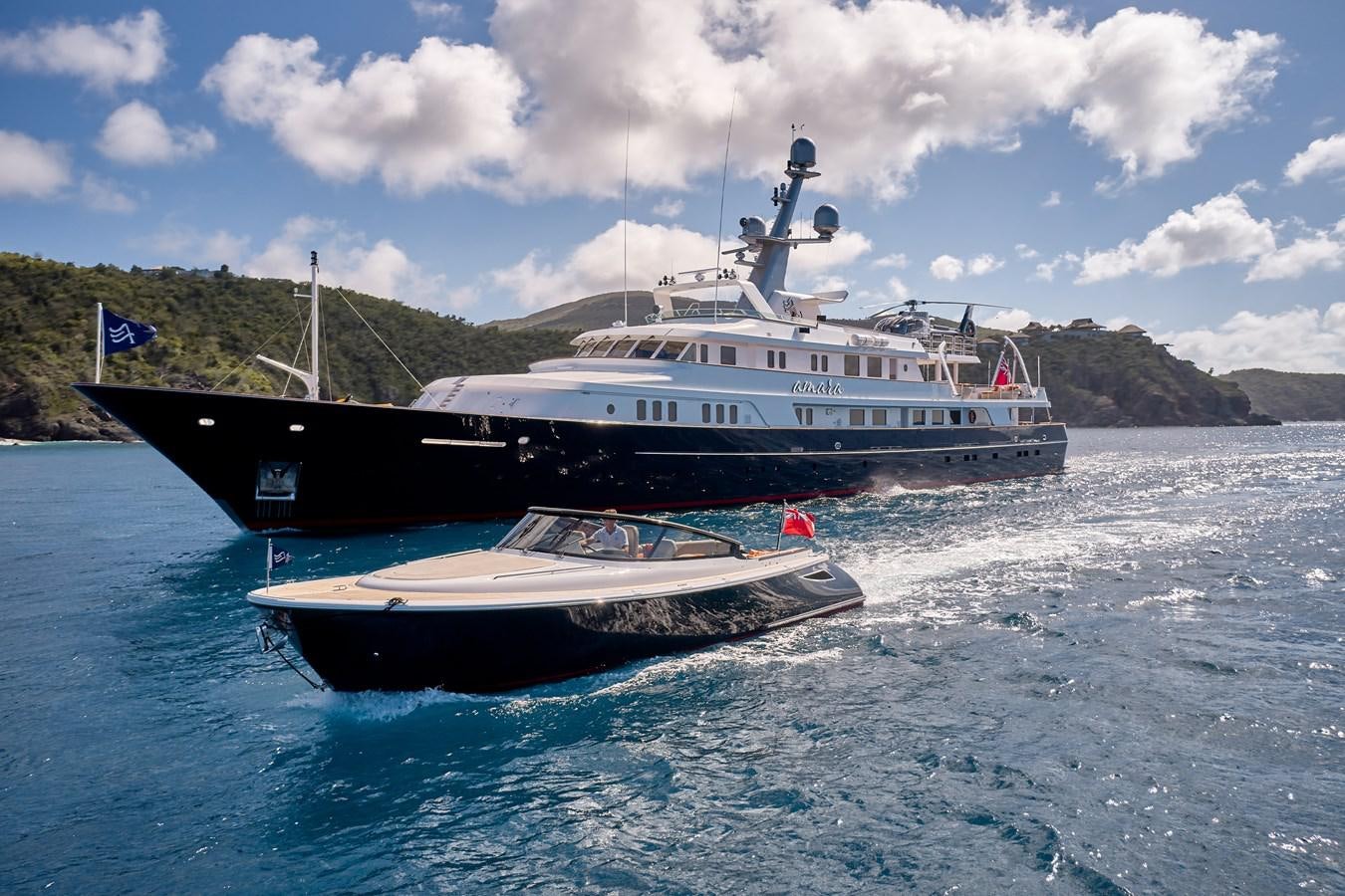 a large ship in the water aboard AMARA Yacht for Sale