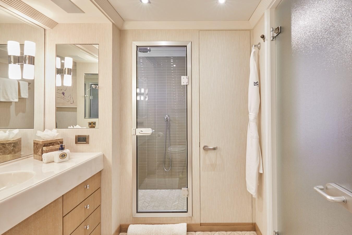 a bathroom with a glass shower aboard AMARA Yacht for Sale