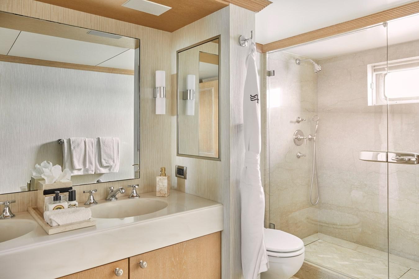 a bathroom with a shower and sink aboard AMARA Yacht for Sale