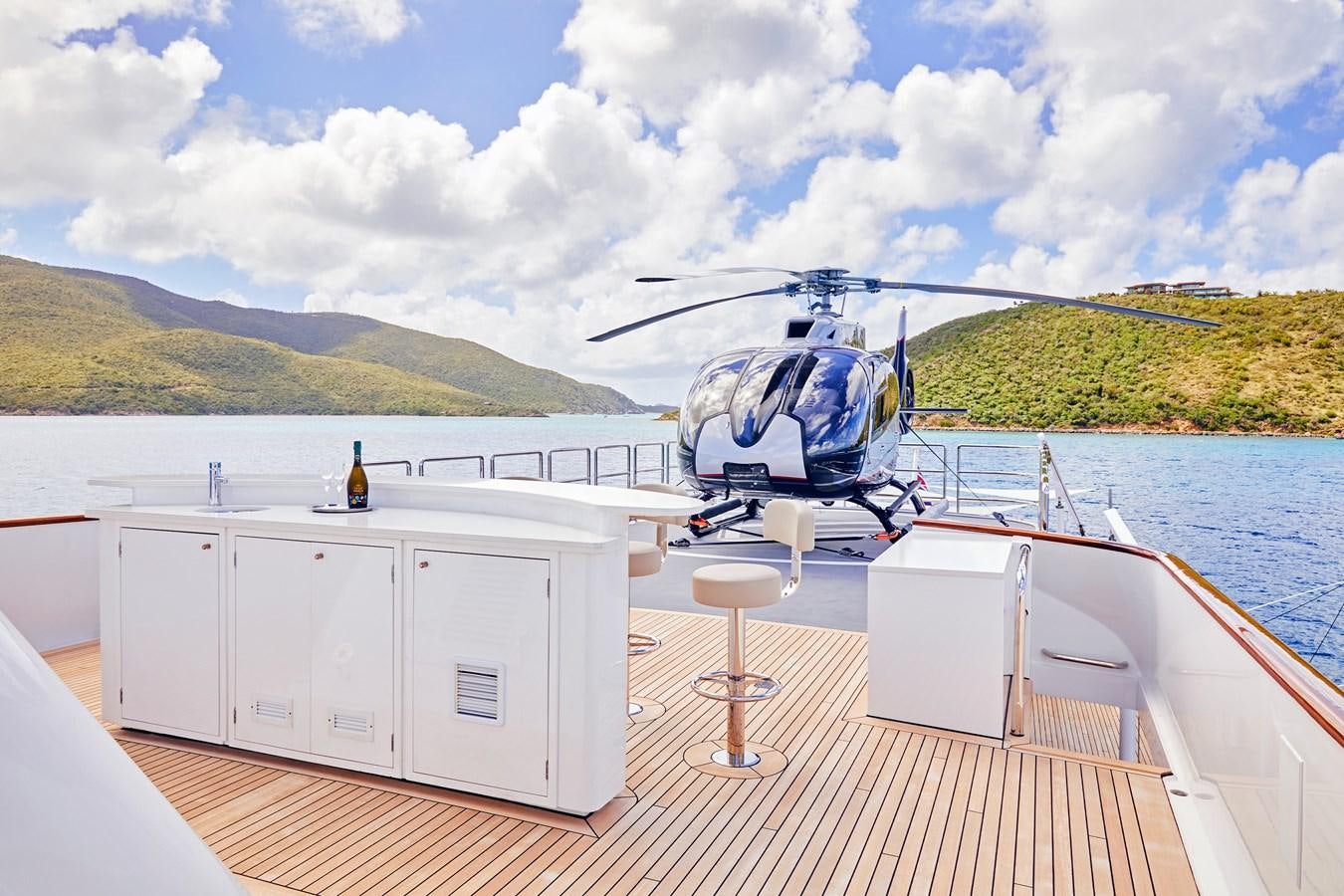 a helicopter on a boat aboard AMARA Yacht for Sale