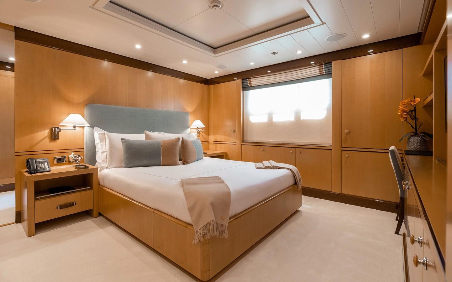 a bedroom with a large bed aboard LIND Yacht for Sale