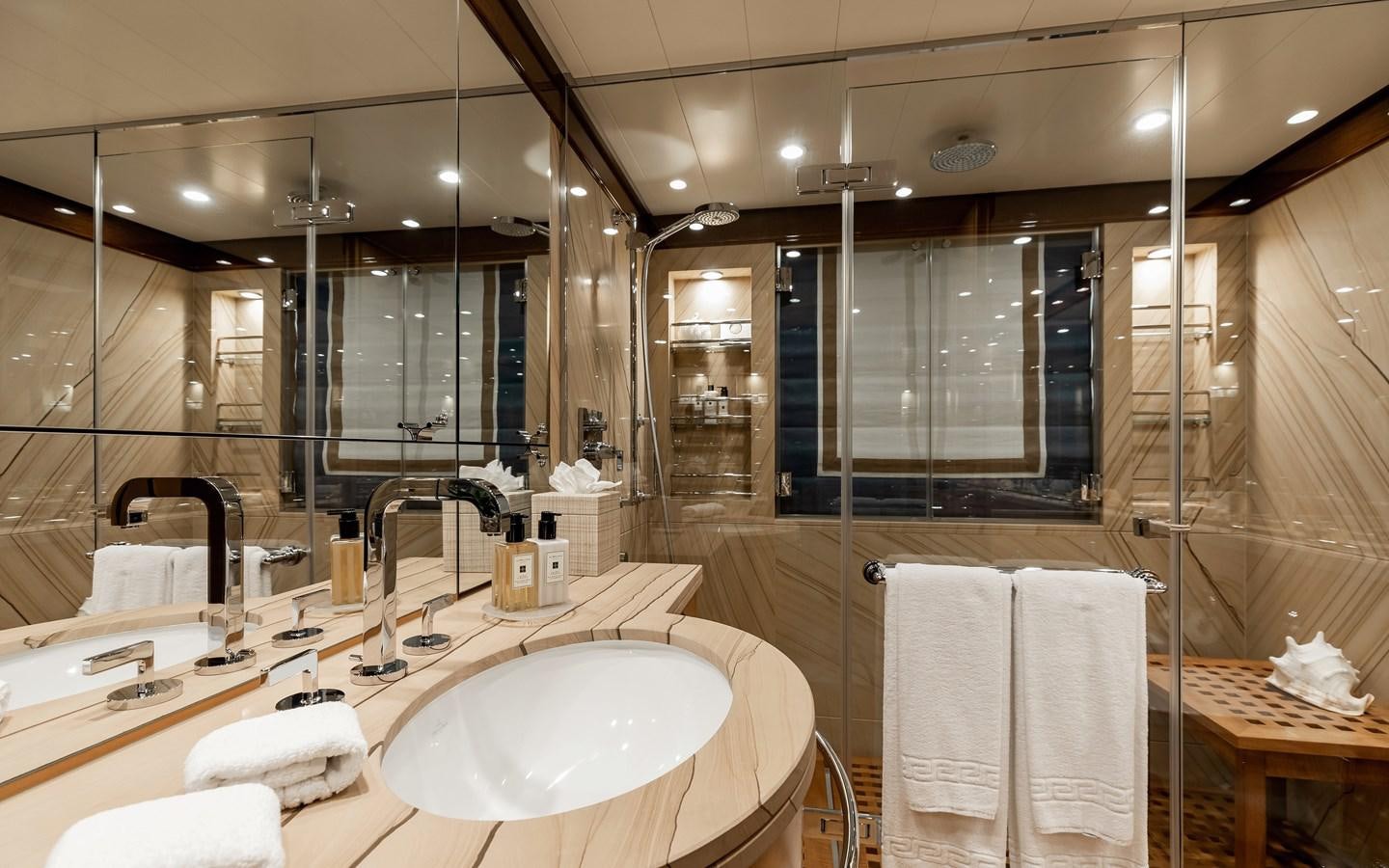 a bathroom with a large mirror aboard LIND Yacht for Sale