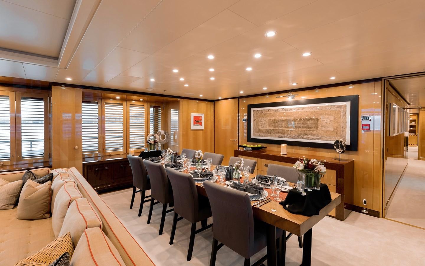 a large dining room with a large table and chairs aboard LIND Yacht for Sale