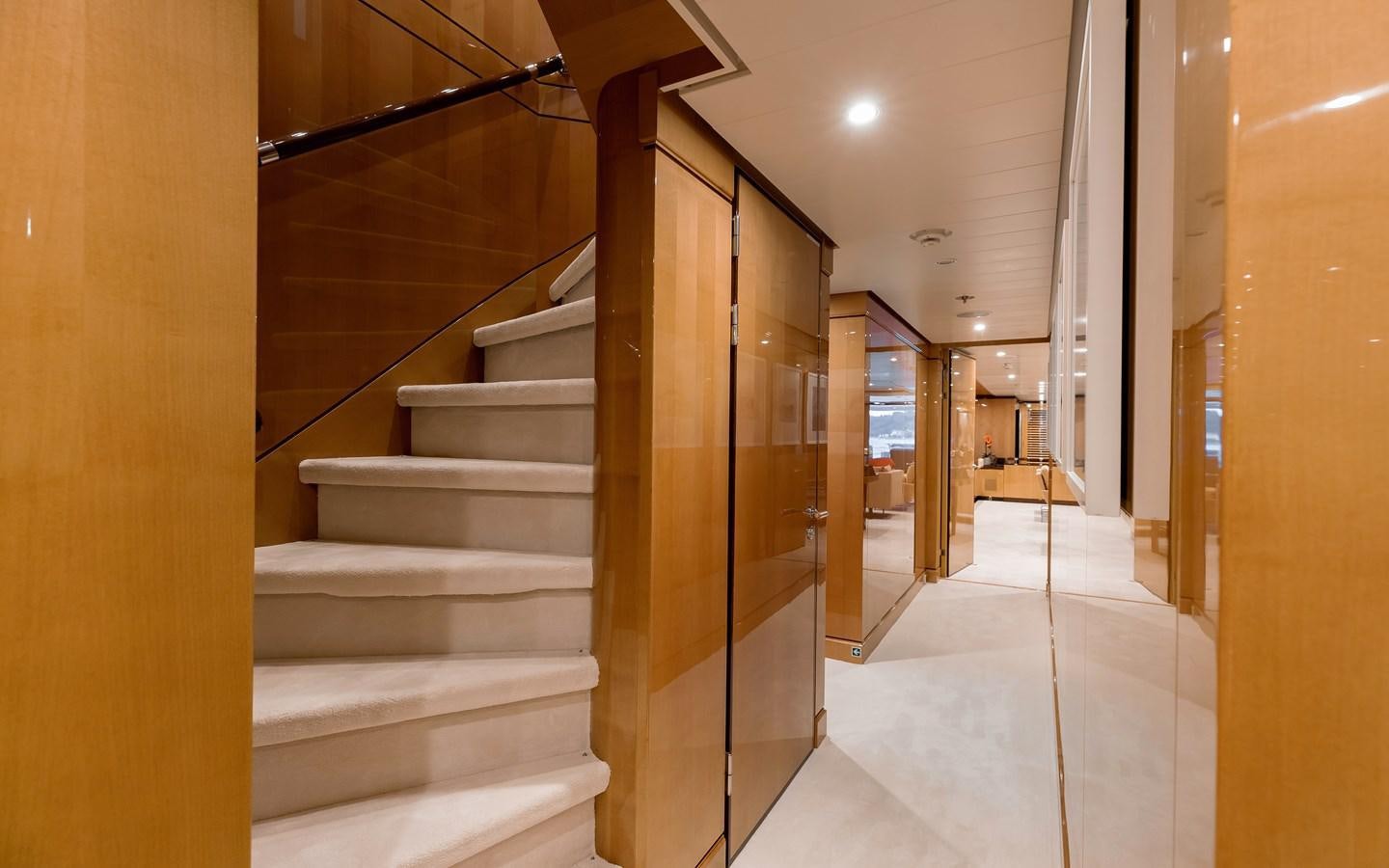 a hallway with a set of stairs aboard LIND Yacht for Sale
