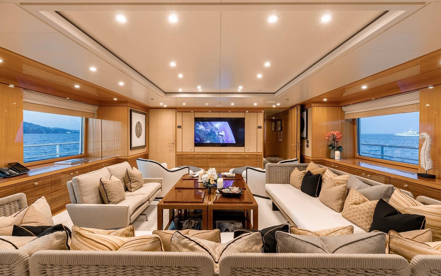 a living room with a large window aboard LIND Yacht for Sale