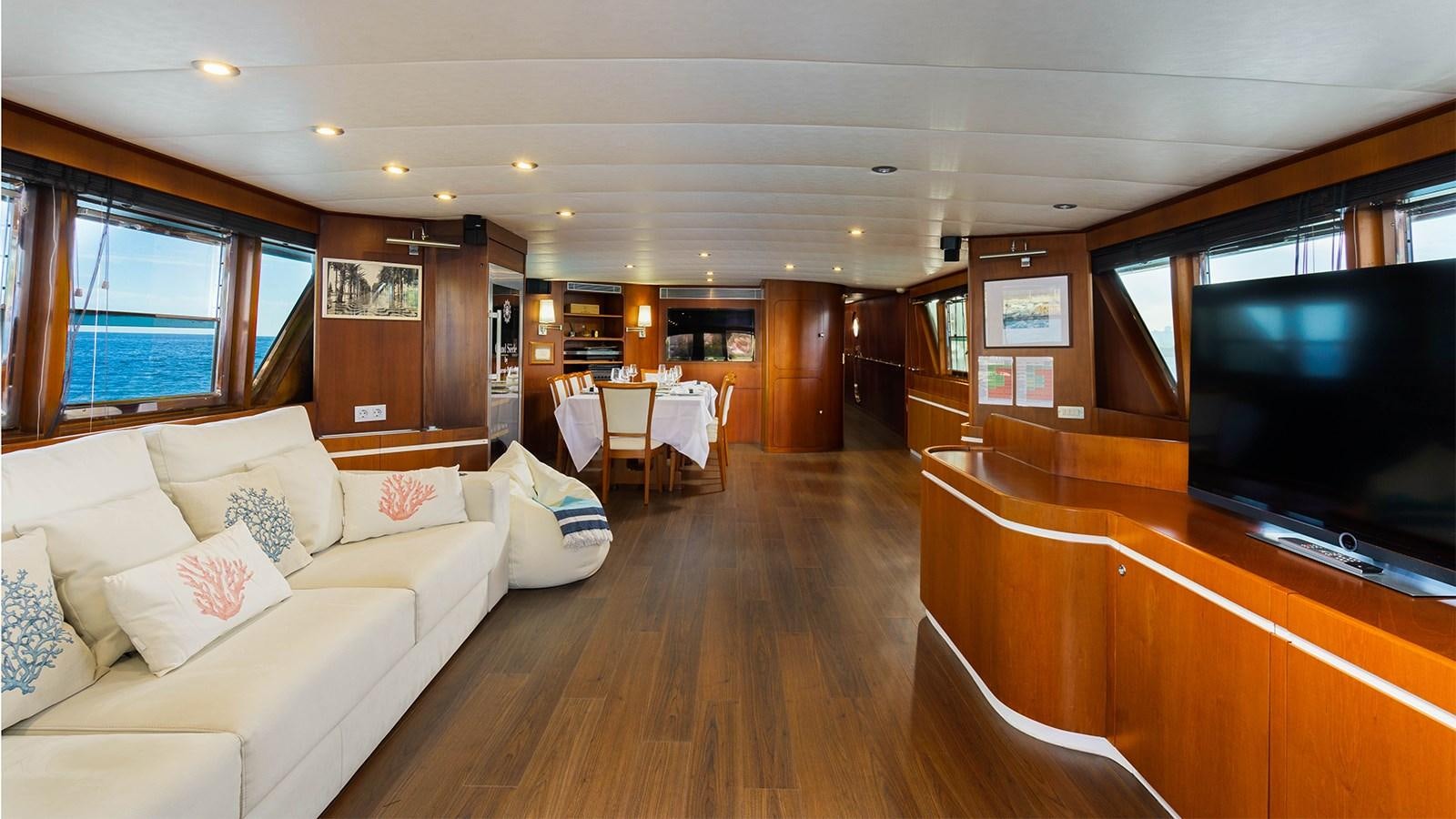 a living room with a wood floor aboard SPIRIT OF MK Yacht for Sale