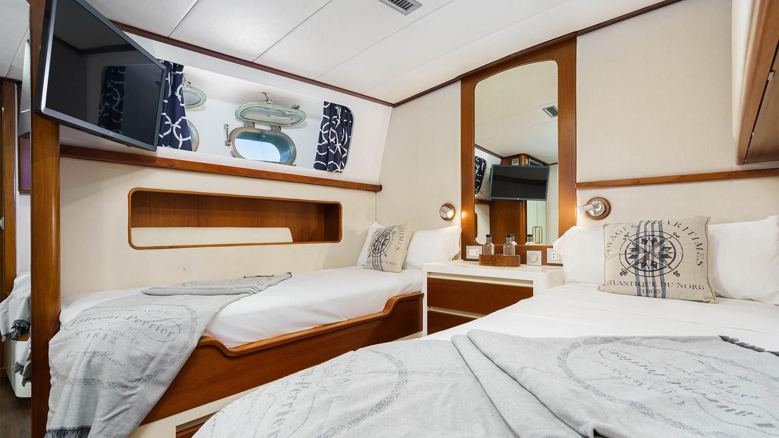 a room with two beds aboard SPIRIT OF MK Yacht for Sale